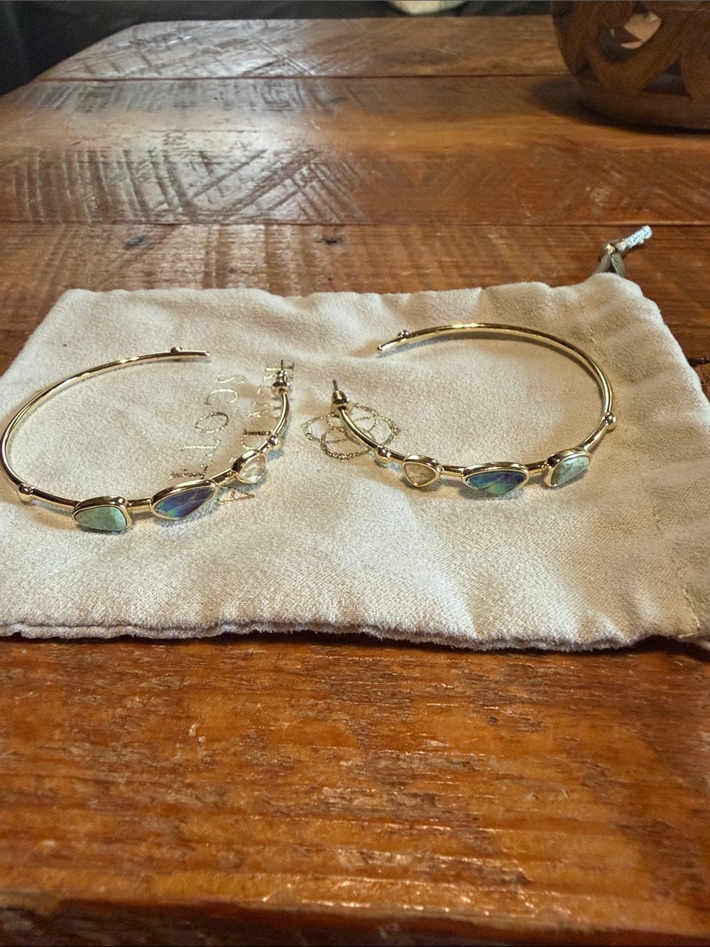 Kendra Scott Gold Hoop Earrings with Iridescent Blue-Green Teardrops